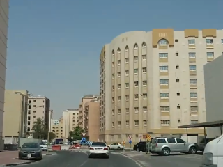 Apartment buildings near a roundabout in Al Mansoura Doha